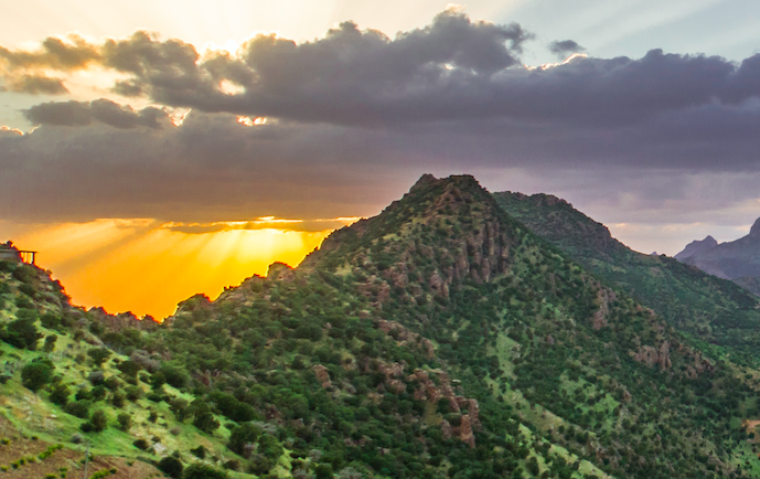 Baha'u'llah in wilderness of Kurdistan - calligrapher on the mountain