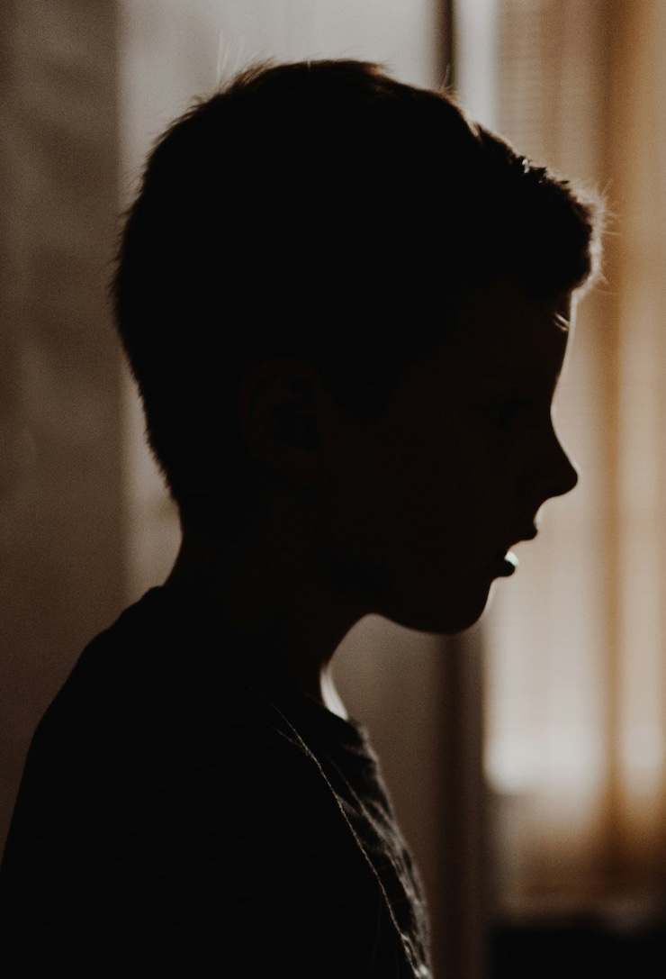 a boy in silhouette